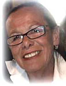In Loving Memory photo of Joan Waddling in a white-collar shirt and black trim glasses