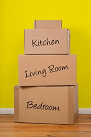 Stack of labeled moving boxes of kitchen, living room and bedroom