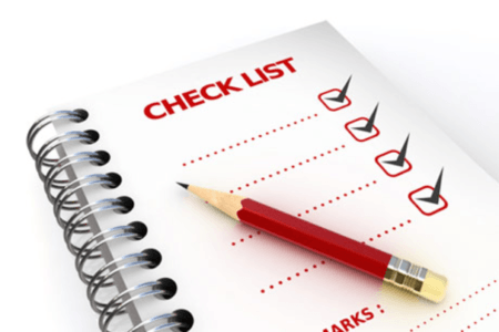Tippet-Richardson white, red, black colored checklist with a red pencil