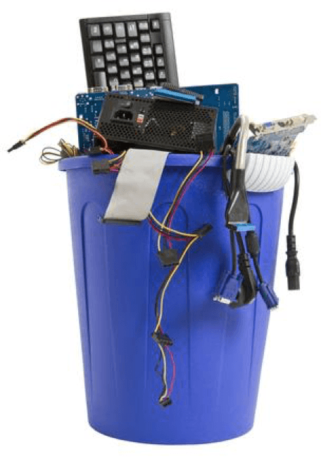 Non functioning computer and electronic equipment is piled up in a blue bin waiting for E-waste services