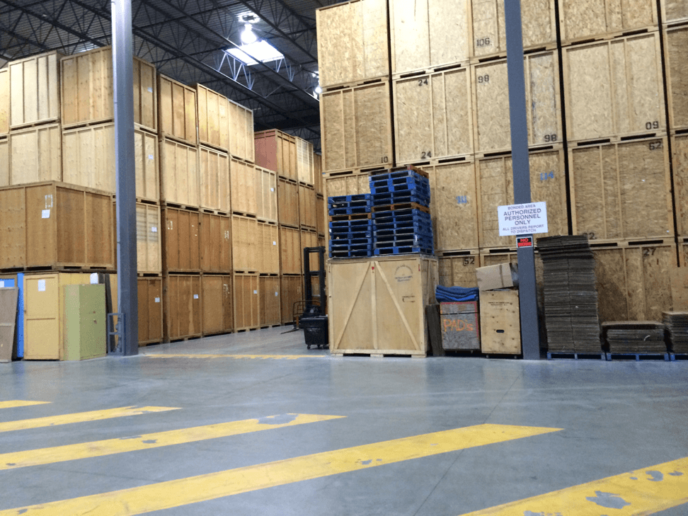 Tippet Richardson storage facility with wooden storage crates stacked up for short and long-distance moves